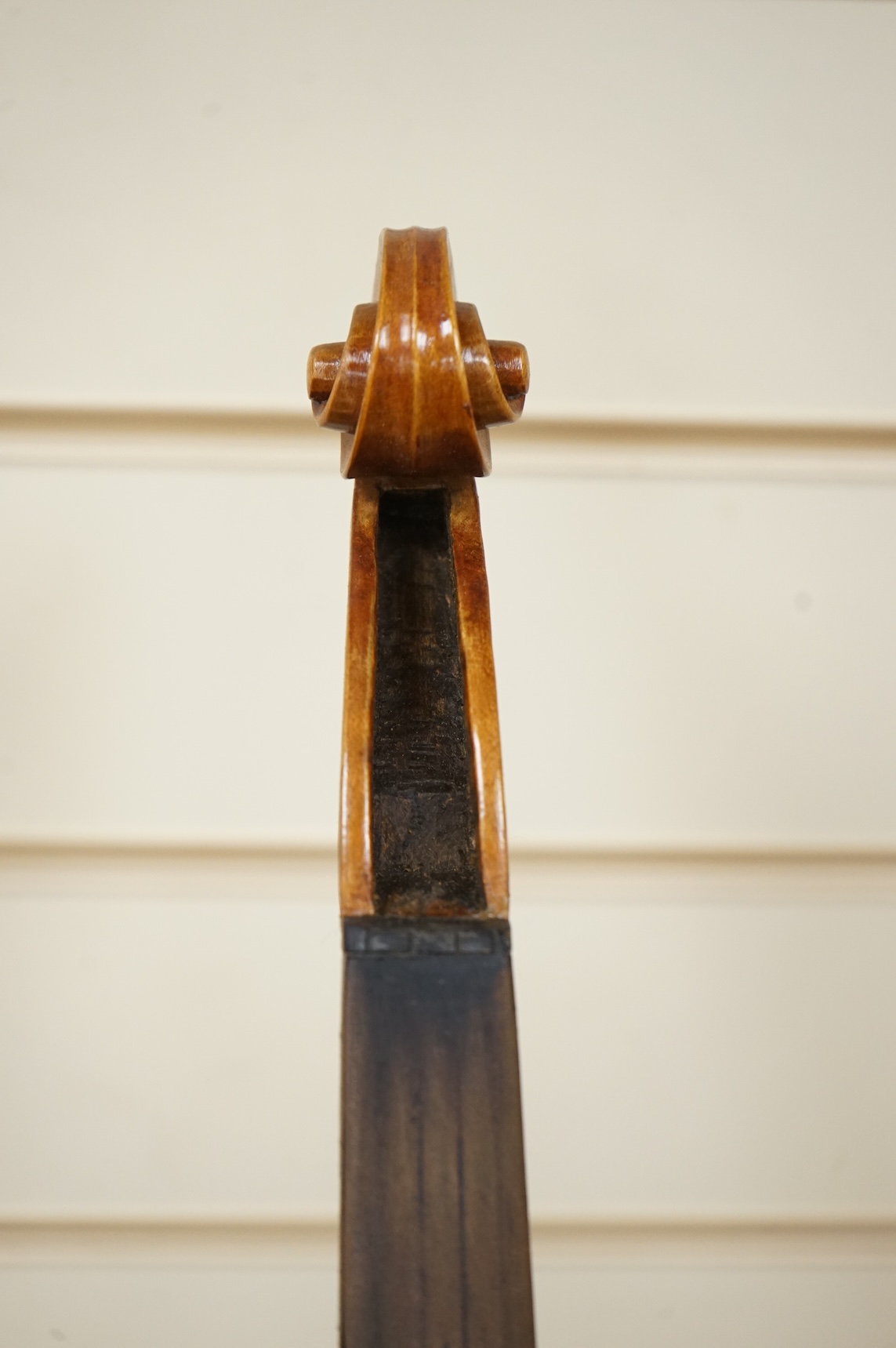 Four violins; a German Dresden violin, together with further two German violins, and a Saxony violin, three in cases or the remains of cases.